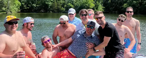 Group of men celebrating a bachelor party aboard a Nashville boat rental.