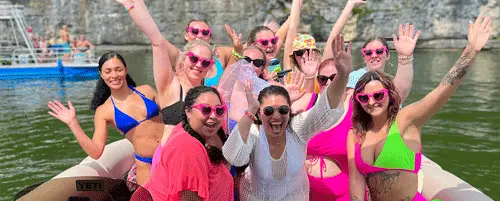 Group celebrating on a Nashville party boat rental with friends on Percy Priest Lake.